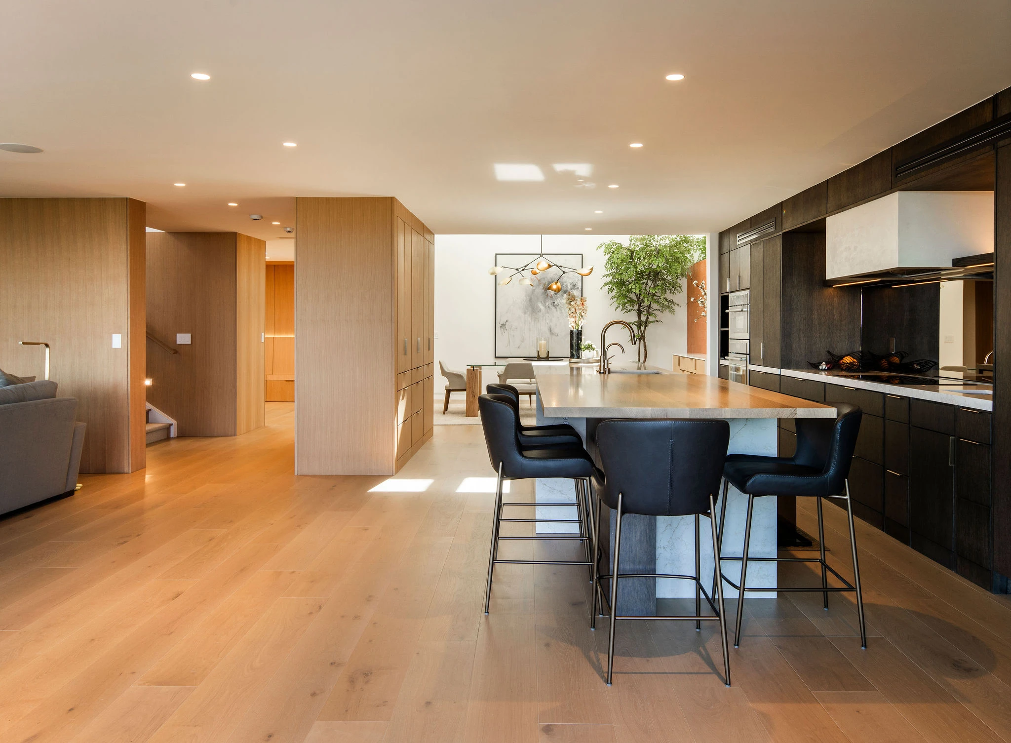 Design-forward kitchen remodel in Santa Monica with island addition